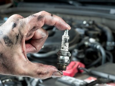 Auto mechanic and sparkplug